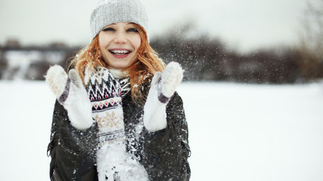 Happy woman in snow