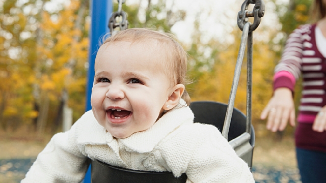 Baby happily playing