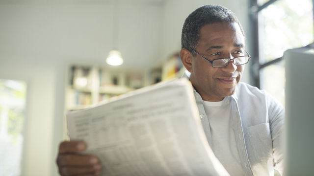 Man reading newspaper