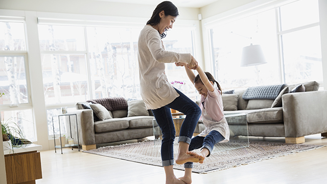 mother is playing with daughter after dental care
