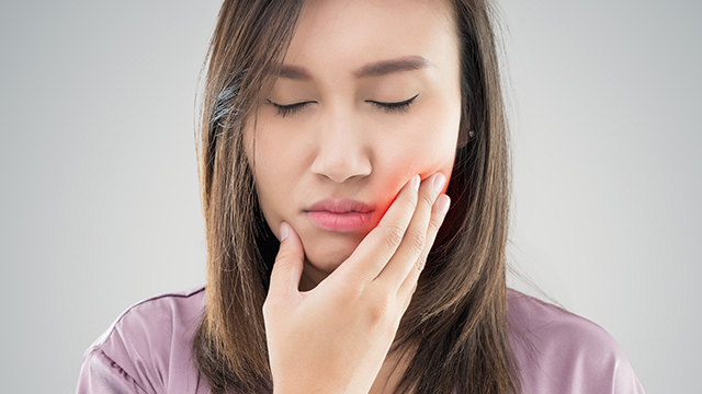 Woman with tooth pain