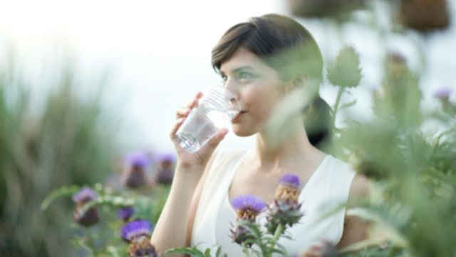 Woman drinking water in a glass