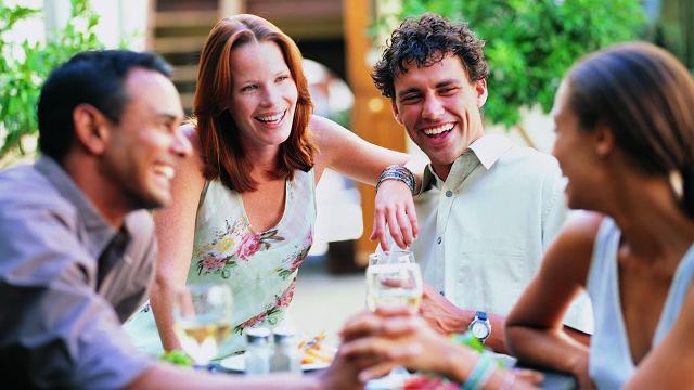 A group of friends are smiling with good teeth because of proper flossing