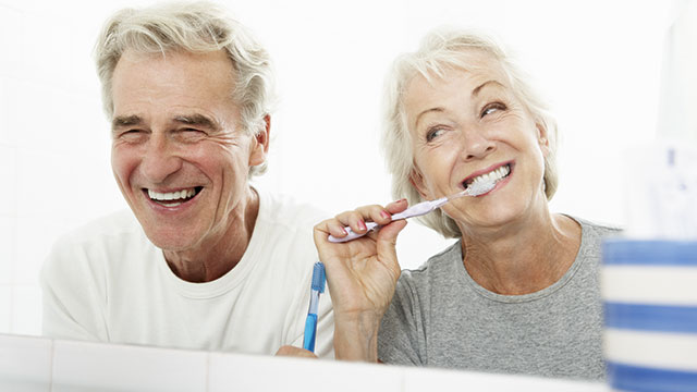 couple brushing their teeth