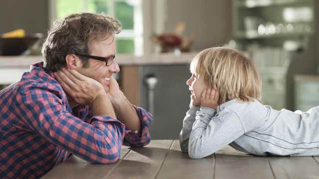 Father and son laughing